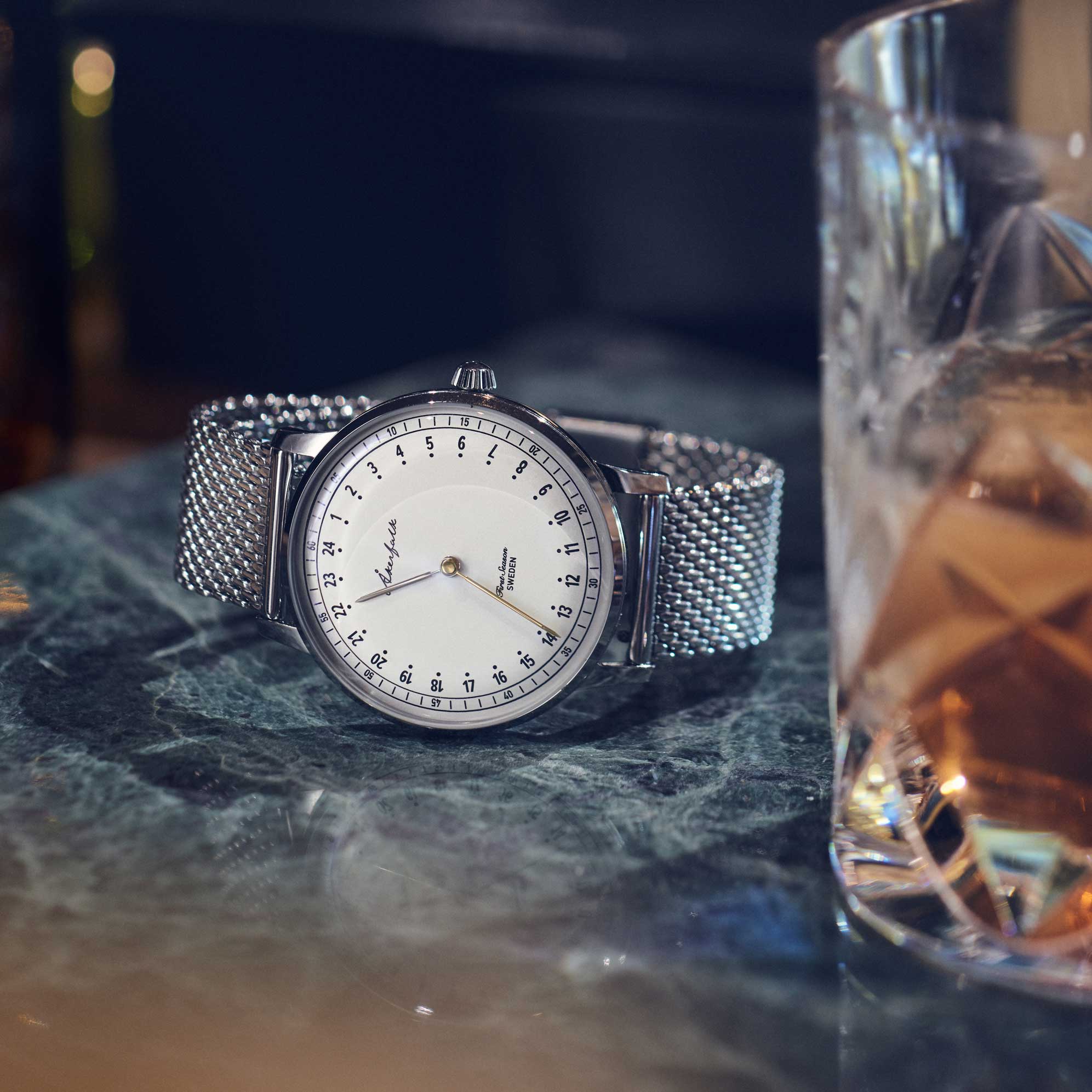 24-hour watch with silver case and silver mesh strap